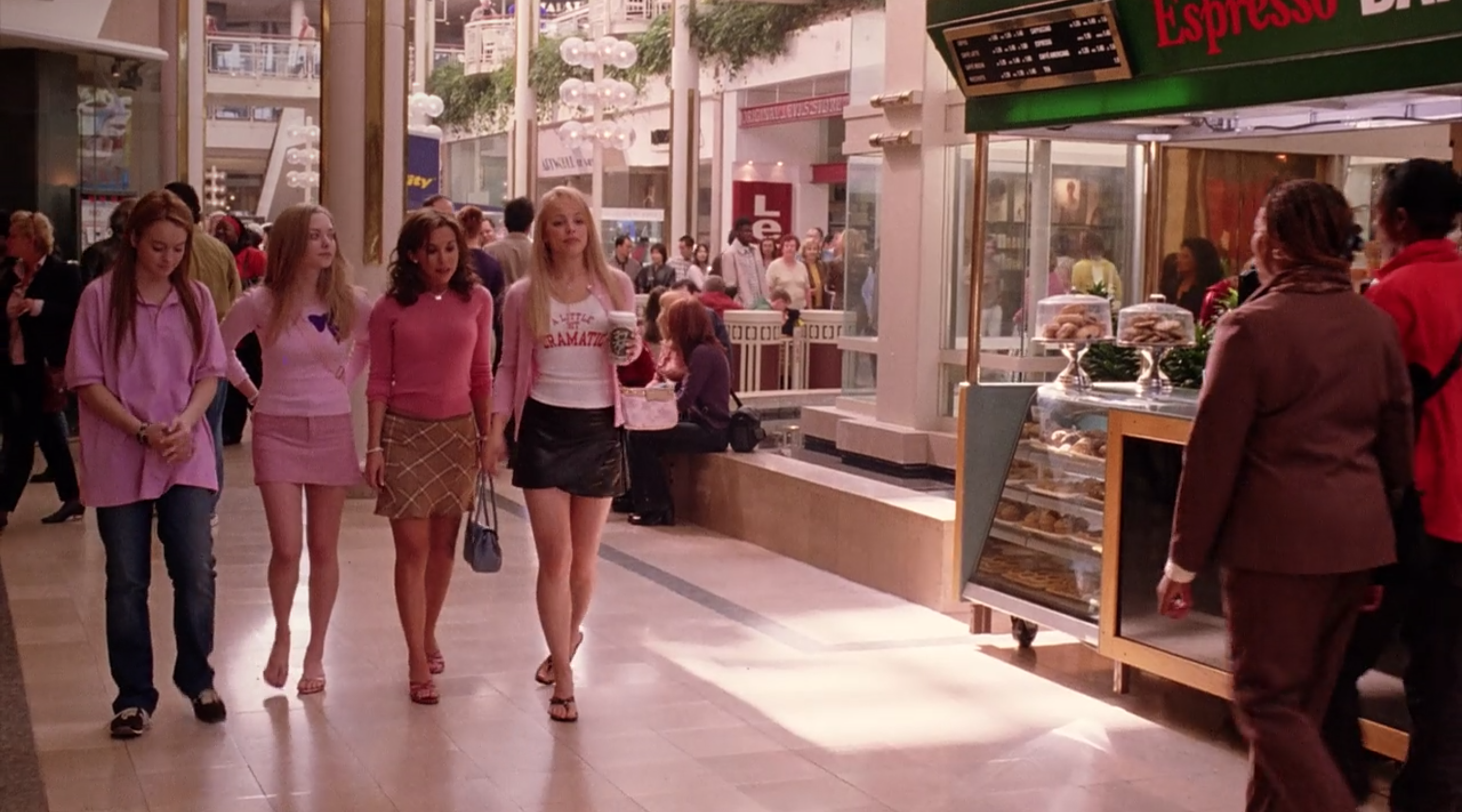The Plastics walk through the mall.